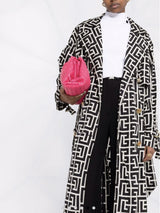 black monogrammed trench coat