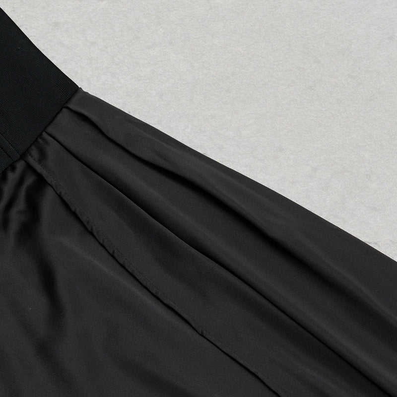 MIDIKLEID MIT RÜSCHEN IN SCHWARZ 